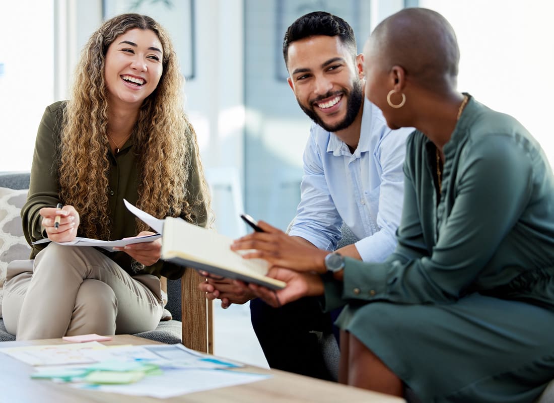 Contact - Happy Business Colleagues Having a Casual Business Meeting in a Modern Office